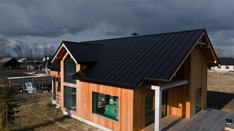 Home with a black standing seam metal roof in Olympia, WA