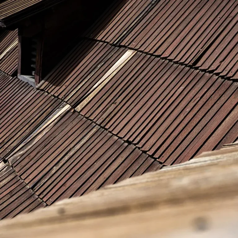 Weathered cedar shake roof texture on an Olympia home