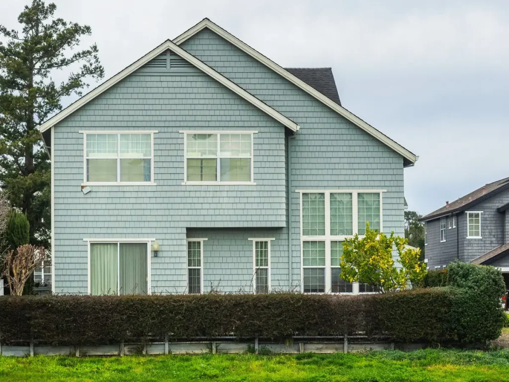 Two-story home with a new shingle roof in a Lacey, WA neighborhood